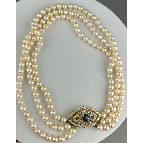 9 - A NECKLACE OF CULTURED PEARLS, JOINED BY A 14CT GOLD, DIAMOND CLASP SET WITH A BLUE STONE, This piec... 