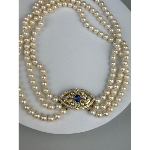 9 - A NECKLACE OF CULTURED PEARLS, JOINED BY A 14CT GOLD, DIAMOND CLASP SET WITH A BLUE STONE, This piec... 