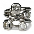 A PLATINUM RING SET WITH FOUR CORNER SQUARE 'LUCIDA' DIAMONDS, The diamonds purchased from Tiffany a... 