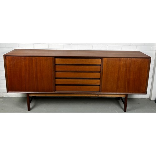 495 - A 1960'S DANISH TEAK SIDEBOARD, 

Sliding doors opening to reveal five shelves.