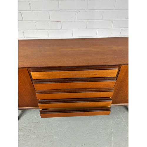 495 - A 1960'S DANISH TEAK SIDEBOARD, 

Sliding doors opening to reveal five shelves.