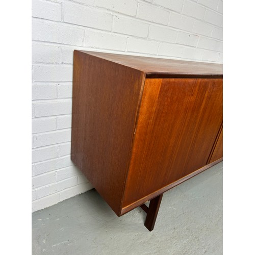 495 - A 1960'S DANISH TEAK SIDEBOARD, 

Sliding doors opening to reveal five shelves.