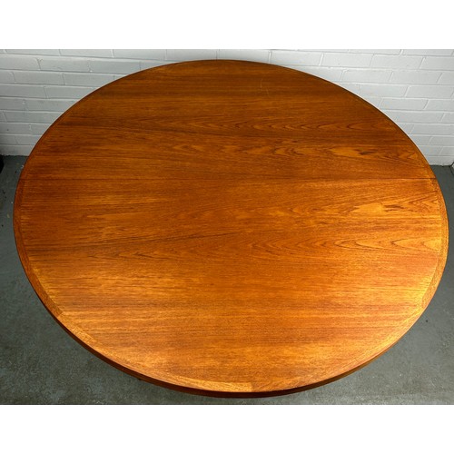 496 - A HELTBORG MOBLER TEAK CIRCULAR EXTENDING DINING TABLE WITH TWO EXTRA LEAVES