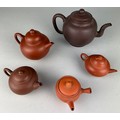 A COLLECTION OF FIVE CHINESE AND JAPANESE YIXING CLAY TEA POTS (5), 

Each of globular form. Largest... 