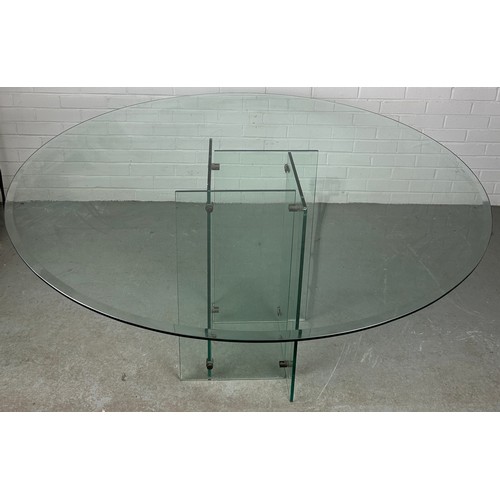 498 - A LARGE MID CENTURY DESIGN GLASS TABLE, 

The circular top raised above base of abstract form

140cm... 