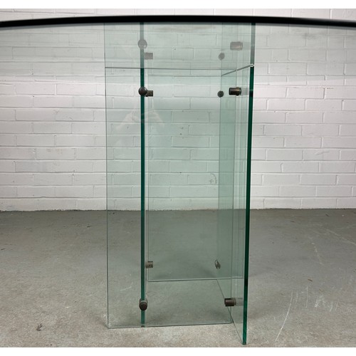 498 - A LARGE MID CENTURY DESIGN GLASS TABLE, 

The circular top raised above base of abstract form

140cm... 