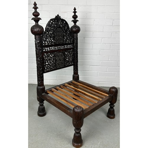 470 - A 19TH CENTURY INDIAN PIDDHA CHAIR, 

Heavily carved hardwood possibly Bombay wood, very low wooden ... 