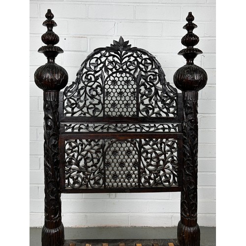 470 - A 19TH CENTURY INDIAN PIDDHA CHAIR, 

Heavily carved hardwood possibly Bombay wood, very low wooden ... 