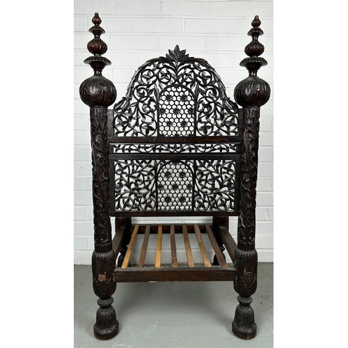 470 - A 19TH CENTURY INDIAN PIDDHA CHAIR, 

Heavily carved hardwood possibly Bombay wood, very low wooden ... 