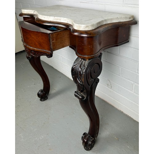 459 - A GEORGIAN DESIGN CONSOLE TABLE WITH WHITE MARBLE TOP, 

Two legs heavily carved with acanthus leave... 