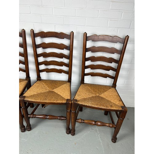 469 - A SET OF FOUR 19TH CENTURY COUNTRY HOUSE LADDERBACK CHAIRS WITH RUSH SEATS (4) 

Each 100cm x 48cm x... 