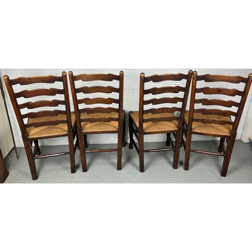 469 - A SET OF FOUR 19TH CENTURY COUNTRY HOUSE LADDERBACK CHAIRS WITH RUSH SEATS (4) 

Each 100cm x 48cm x... 