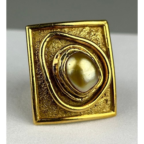 4 - NEVIN HOLMES (TURKISH) AN 18CT GOLD RING INSET WITH A PEARL, 

Born in Budapest, Nevin was the daugh... 