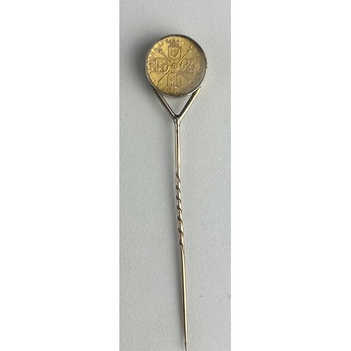 54 - A GEORGE I GOLD QUARTER GUINEA 1718, 

Mounted on a gold pin between glass.

Weight: 5.2gms