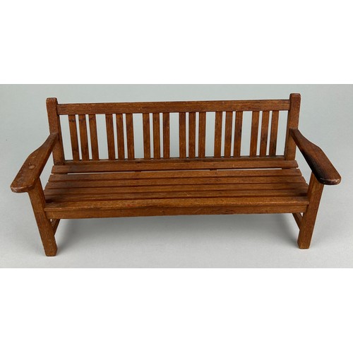 485 - AN APPRENTICE MODEL OF A GARDEN BENCH, 20TH CENTURY