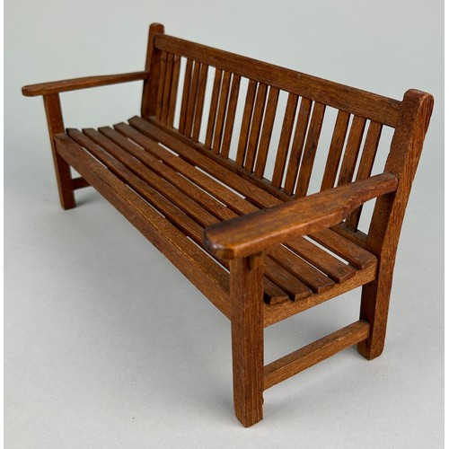 485 - AN APPRENTICE MODEL OF A GARDEN BENCH, 20TH CENTURY