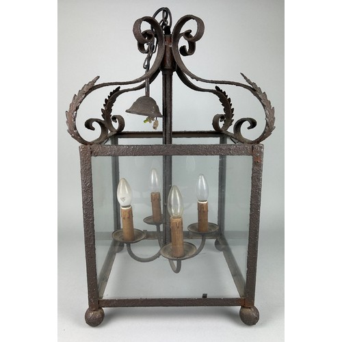 535 - AN ORNATE ANTIQUE CAST METAL HANGING LANTERN, 68cm h x 39.5cm w

Used condition due to age and wear.