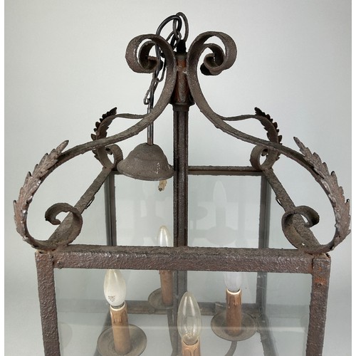 535 - AN ORNATE ANTIQUE CAST METAL HANGING LANTERN, 68cm h x 39.5cm w

Used condition due to age and wear.