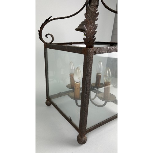 535 - AN ORNATE ANTIQUE CAST METAL HANGING LANTERN, 68cm h x 39.5cm w

Used condition due to age and wear.