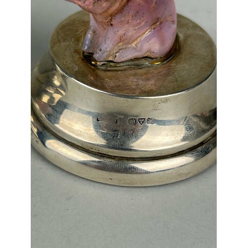 65 - A PAIR OF PINK QUARTZ CRYSTAL PIGS MOUNTED ON SILVER DESK WEIGHTS, 

With red leather bases.

6.5cm ... 