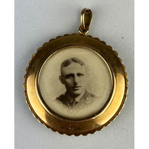 48 - A 15CT GOLD LOCKET PENDANT WITH SEED PEARL BORDER, 

Photograph of soldier and young girl (possibly ... 