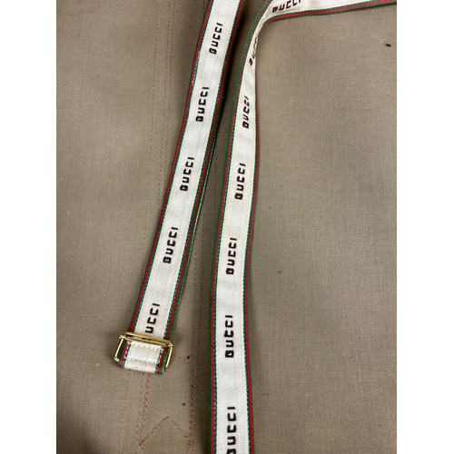 359A - GUCCI LUGGAGE: A VINTAGE GUCCI SUITCASE,

Gucci monogram throughout with brown stitched leather stra... 