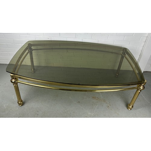 538 - A HOLLYWOOD REGENCY STYLE COFFEE TABLE, gold with glass surface top, 142cm w x 90cm d x 48cm h 


Us... 