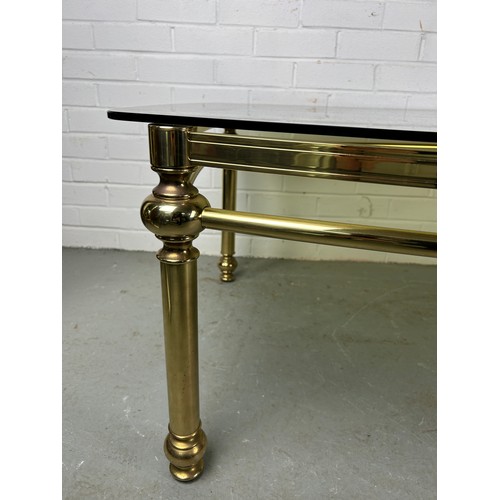 538 - A HOLLYWOOD REGENCY STYLE COFFEE TABLE, gold with glass surface top, 142cm w x 90cm d x 48cm h 


Us... 