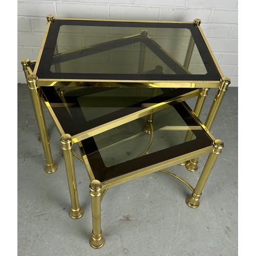 539 - A NEST OF THREE HOLLYWOOD REGENCY STYLE BRASS TABLES, measuring 58cm w x 38cm d x 45cm h (largest) a... 