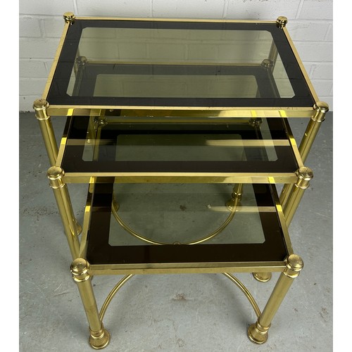 539 - A NEST OF THREE HOLLYWOOD REGENCY STYLE BRASS TABLES, measuring 58cm w x 38cm d x 45cm h (largest) a... 