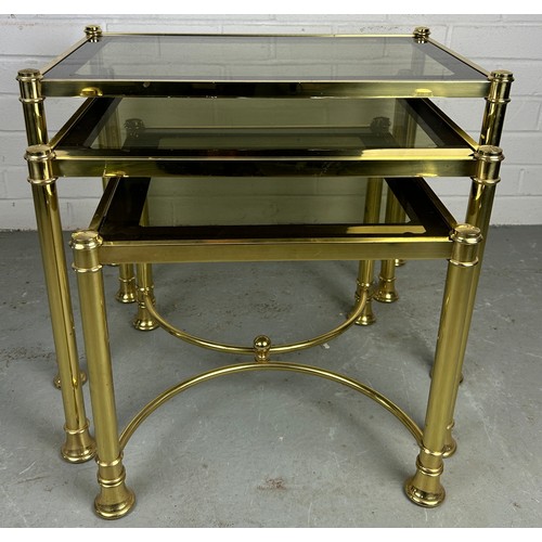 539 - A NEST OF THREE HOLLYWOOD REGENCY STYLE BRASS TABLES, measuring 58cm w x 38cm d x 45cm h (largest) a... 