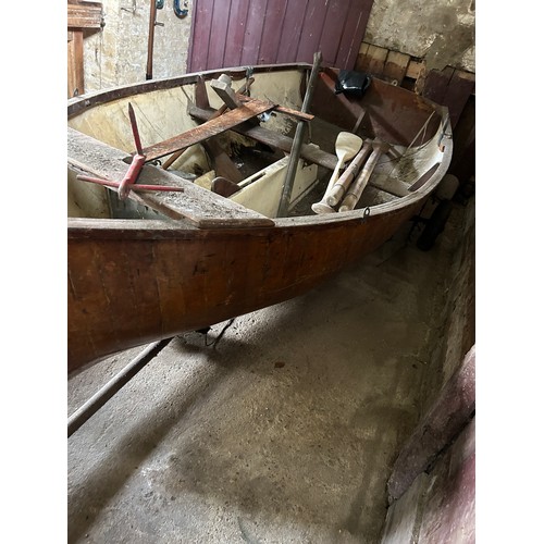 491 - A LARGE ROWING BOAT BUILT BY HAND BY THE VENDORS FATHER, 
 
Along with two oars, various related equ... 