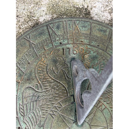 490A - A LARGE STONE SUNDIAL, 

Dated 1793 'Time Flyes', but later.

Diameter of top: 25cm 
Diameter of bas... 