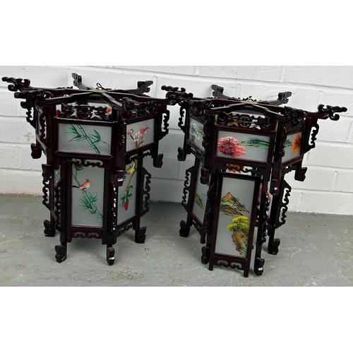 526 - A PAIR OF CHINESE LANTERNS, with hand painted individual glass panels, 36cm h x 40cm w (each) (2)


... 