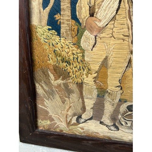 394A - A GEORGIAN PICTORAL WOOL WORK DEPICTING A YOUNG MAN WITH A DOG, 

Possibly late 18th century.