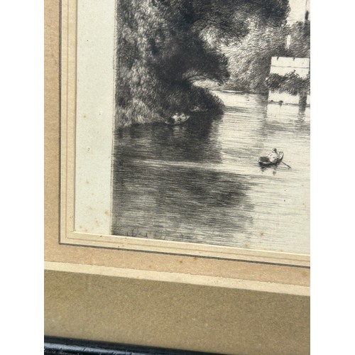 395 - A 19TH CENTURY ETCHING OF A FIGURE ROWING A BOAT ON A RIVER WITH A CASTLE IN THE BACKGROUND,

Mounte... 