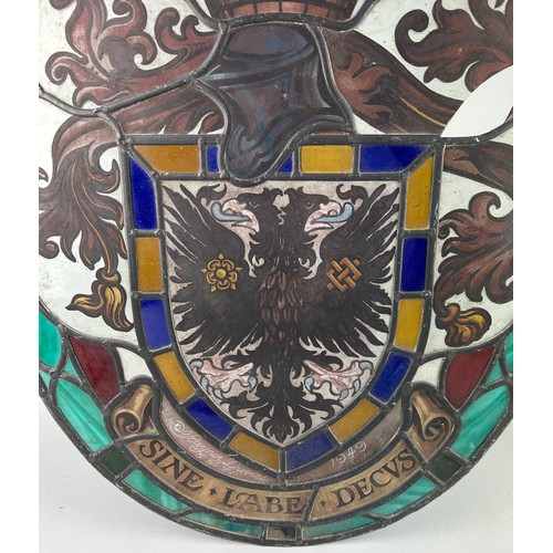 563 - WIMBLEDON INTEREST: A STAINED GLASS PANEL WITH COAT OF ARMS, 

From a church in Wimbledon. Some dama... 