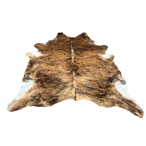 556 - A LARGE COW HIDE RUG,

190cm x 180cm