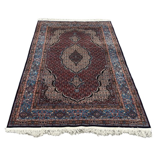 560 - A LARGE AND FINE PERSIAN DESIGN CARPET, 

In very good condition. 300cm x 185cm