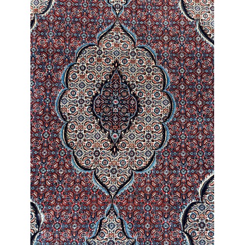 560 - A LARGE AND FINE PERSIAN DESIGN CARPET, 

In very good condition. 300cm x 185cm