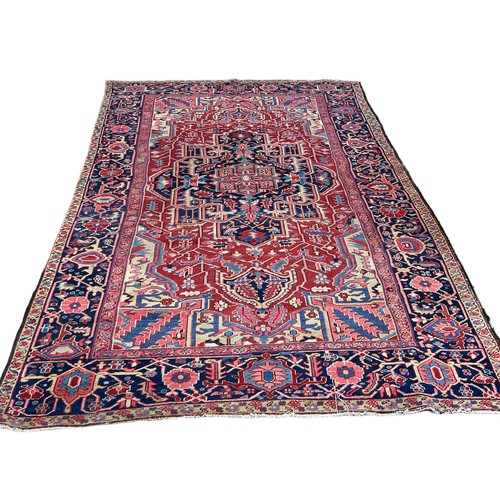 455A - A LARGE ANTIQUE TURKISH RUG, 

345CM X 235CM