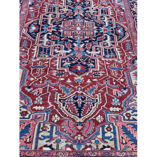 455A - A LARGE ANTIQUE TURKISH RUG, 

345CM X 235CM