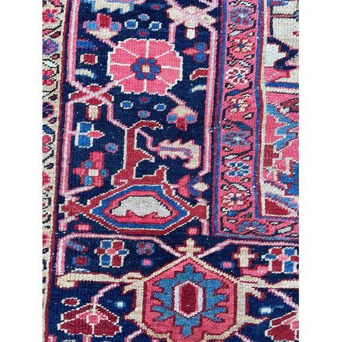 455A - A LARGE ANTIQUE TURKISH RUG, 

345CM X 235CM