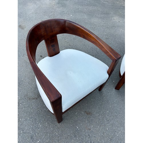 483 - IN THE MANNER OF DAVID LINLEY: TWO DEEP SEATED MID CENTURY ARMCHAIRS WITH WHITE UPHOLSTERED SEATS (2... 