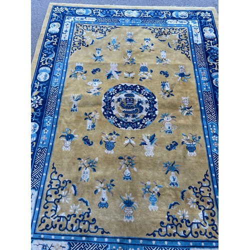 455B - A LARGE CHINESE YELLOW GROUND CARPET WITH VASES OF FLOWERS,

295CM X 215CM