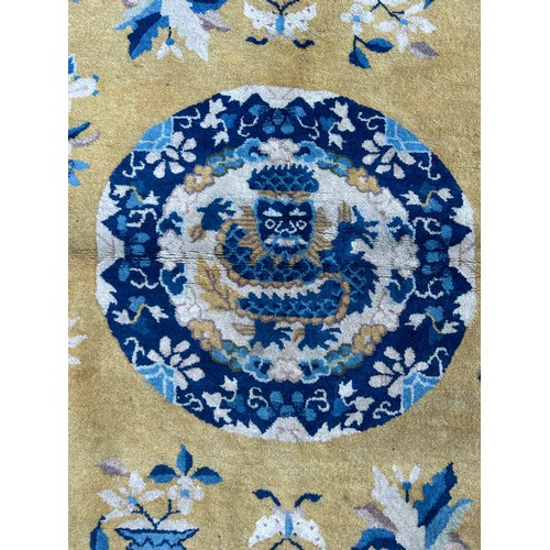 455B - A LARGE CHINESE YELLOW GROUND CARPET WITH VASES OF FLOWERS,

295CM X 215CM