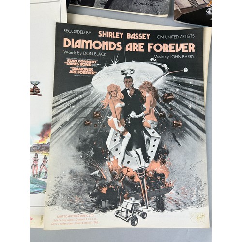 435 - A COLLECTION OF JAMES BOND FILM EPHEMERA, SHEET MUSIC AND MAGAZINES (Qty) 

Various films.