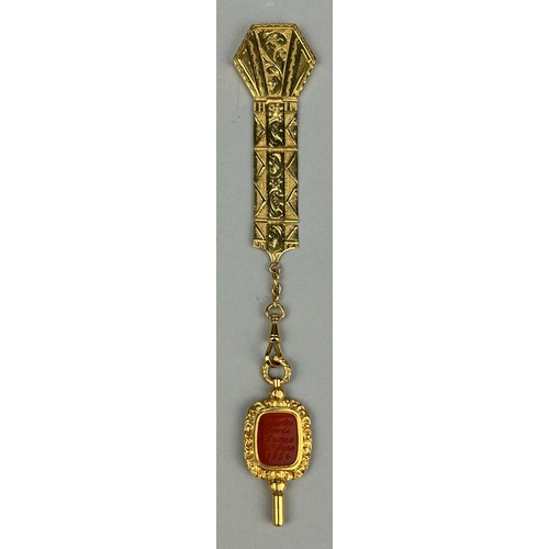 55A - VICTORIA CROSS MEMORABILIA: AN ORNATE 15CT GOLD POCKET WATCH FOB WITH CENTRAL RED CARNELIAN INTAGLIO... 