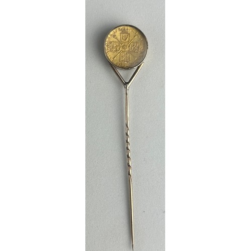 75 - A GEORGE I GOLD QUARTER GUINEA 1718, 

Mounted on a gold pin between glass.

Weight: 5.2gms