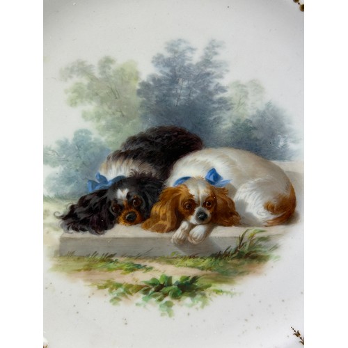 488 - A LATE VICTORIAN MINTON PLATE WITH CENTRAL CIRCULAR PANEL DECORATED WITH TWO DOGS,